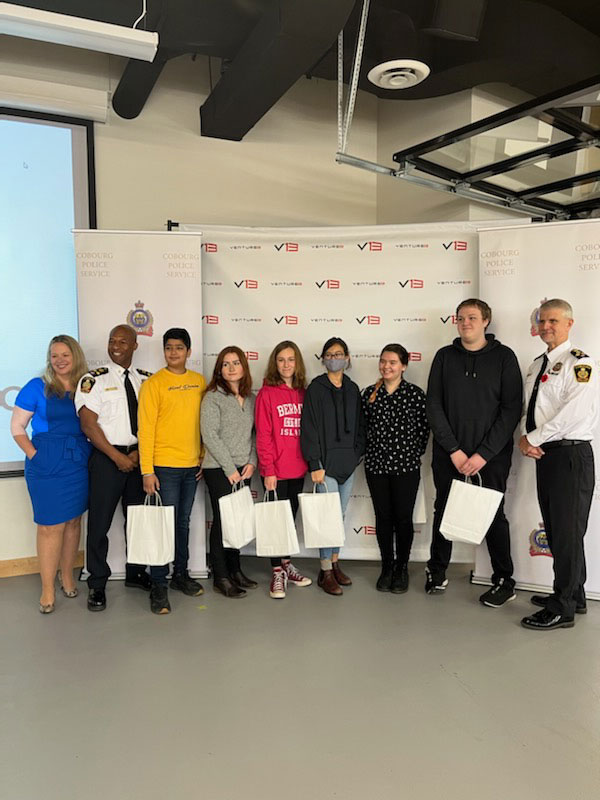 CCI students pose with the judging panel, including Chief of Police, Paul VandeGraaf, Deputy Chief, Jeffrey Haskins, and Town of Cobourg’s CAO, Tracey Vaughan.